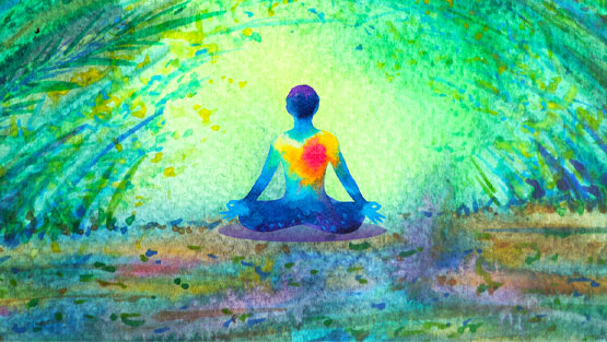 Person meditating with a green aura surrounding them.