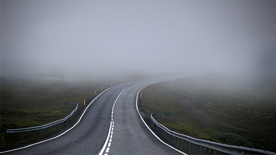 Image of a lonely winding road.