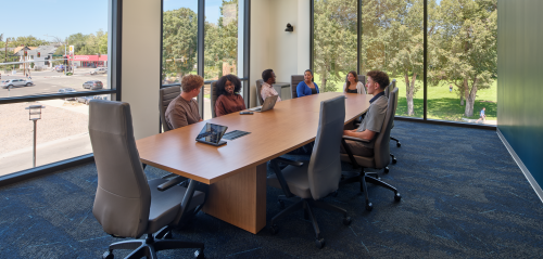 people sitting at a conference table