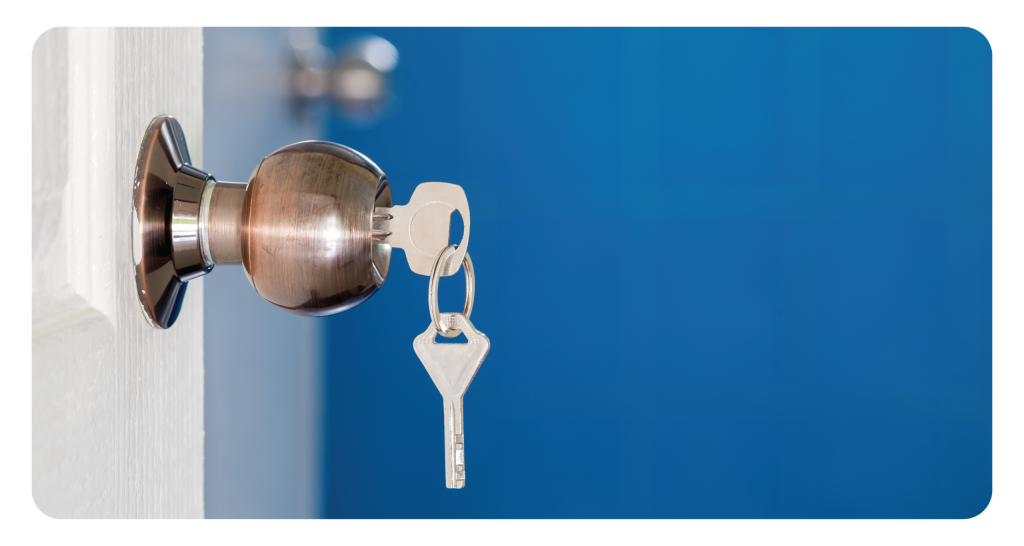 Open door with keys, key in keyhole.