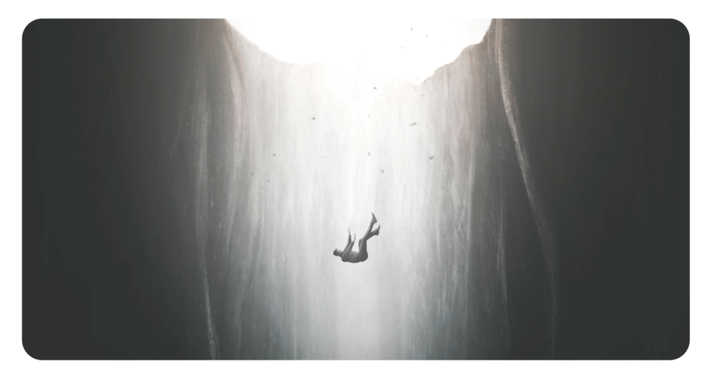 Person falls into deep pit of water. The light fades into a deep darkness as they fall. Concept of loosing person to suicide.